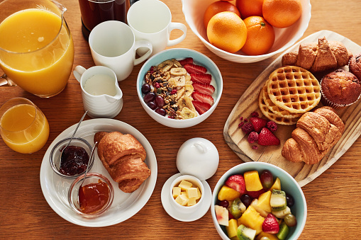 High angle shot of a delicious breakfast spread on a table at home