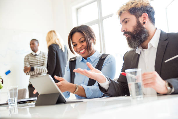 istock Confident female manager in conversation with a colleague 1147964744