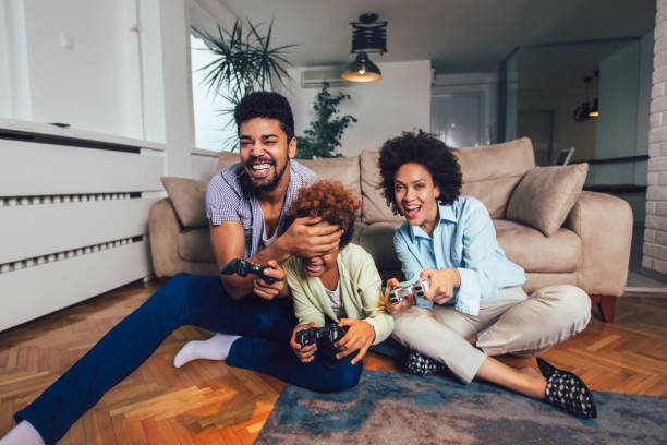 istock Family Playing Video Games Together 1147965111