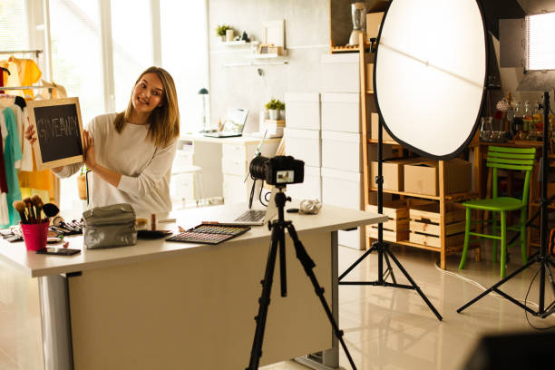 istock Make-up blogger making video in front of the camera 1147966169