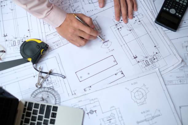 istock architect engineer working on house blueprint of real estate project at workplace. construction & building concept 1147966246