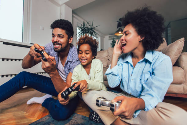 istock Family Playing Video Games Together 1147966388