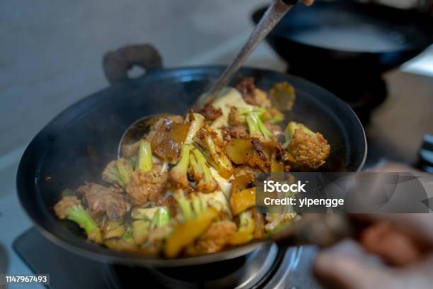Homemade Hodgepodge Dishbraised Pork Ribvegetables And Noodles In Iron Stir Pan Stock Photo - Download Image Now