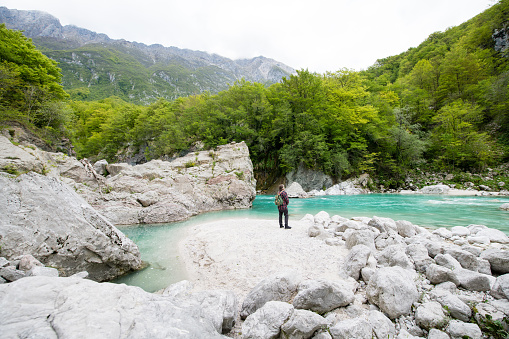 Man admiring River Soca Canyon Valley between Kobard and Bovec, Julian Alps, Slovenia, Europe