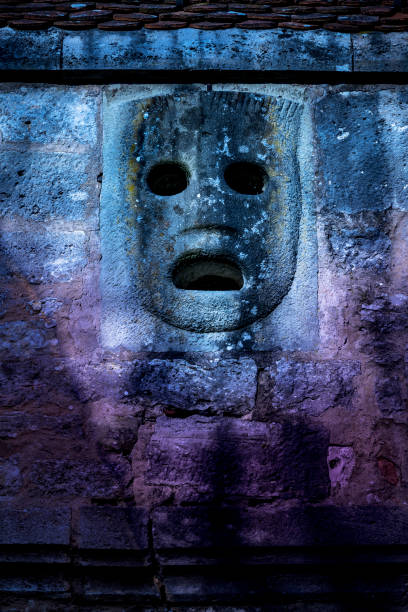 istock Historic stone mask in purple and blue 1147971358
