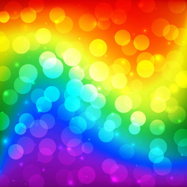 istock LGBT color blur bokeh festive background, rainbow colorful abstract graphic for bright design. Gay lesbian transgender gradient rainbow blurred wave background. Multicolor lgbt flag for parade 1147972021