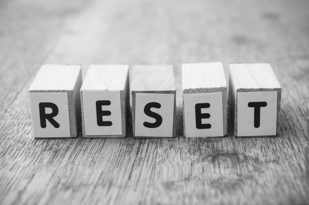 istock word on wooden cube on wooden desk background concept - Reset 1147972562