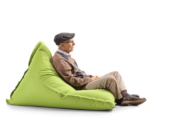 istock Elderly man resting on a bean bag 1147973561