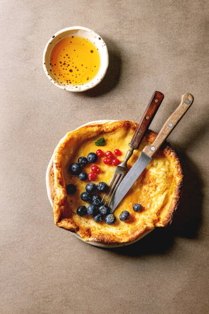 istock Dutch baby with berries 1147973892