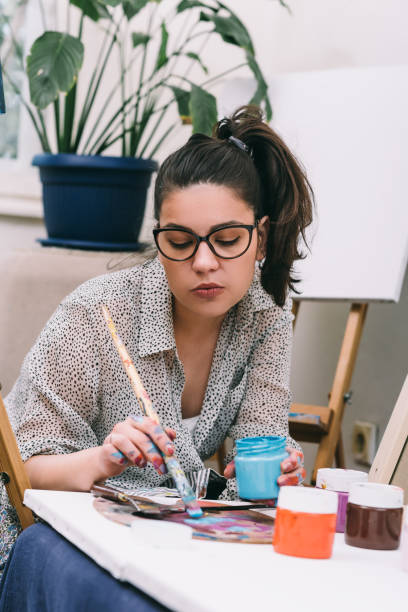 istock Fine art female painter in her studio 1147974674