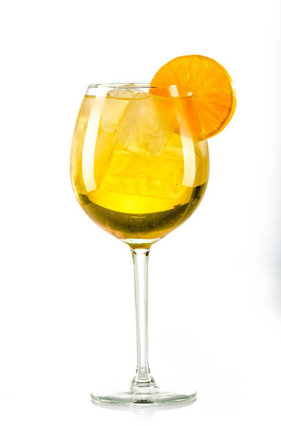 istock orange yellow drink with ice cubes and orange slice on white background, isolated 1147974736