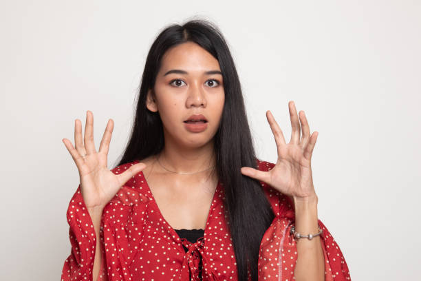 istock Shocked young Asian woman. 1147974929