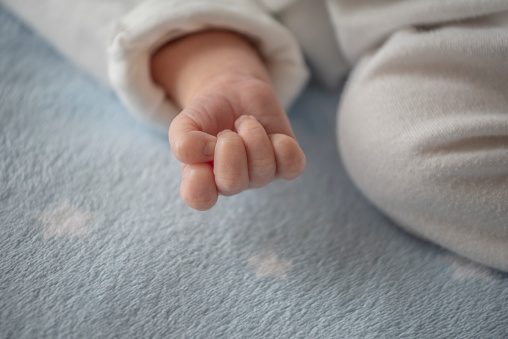 little hand of sleeping baby newborn