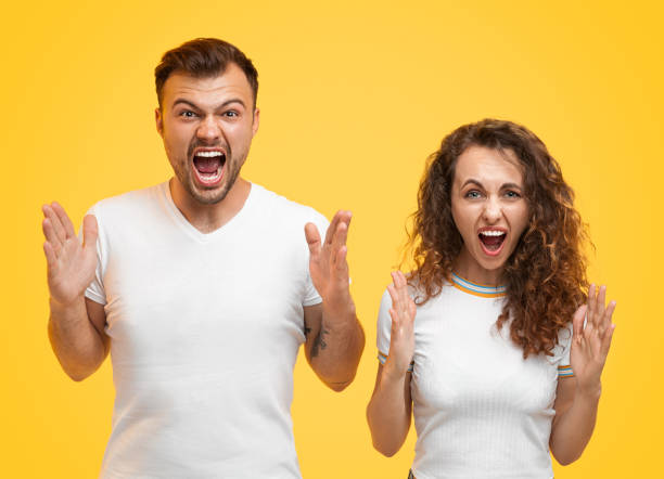 istock Shocked man and woman showing size with hands 1147978421