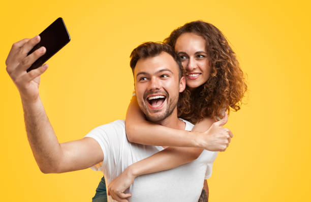 istock Loving couple taking selfie with phone 1147978498