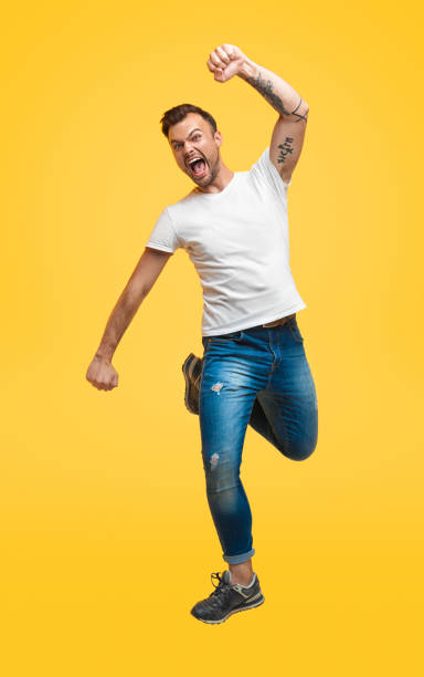 istock Excited casual man flying up in jump 1147978504