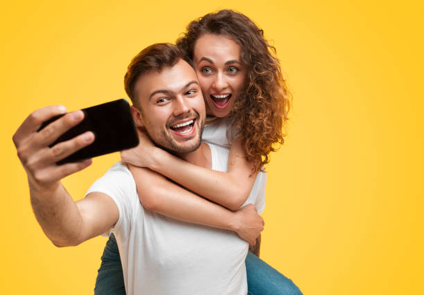 istock Couple having fun and taking selfie 1147978519