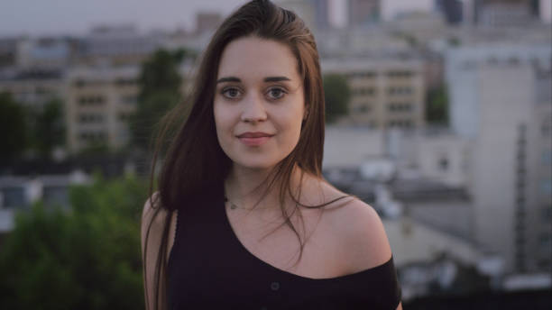 istock Seductive young woman posing on a rooftop 1147980059