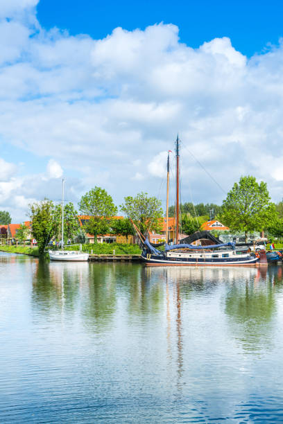 istock Yachts and barges in a canal in Edam, Netherlands 1147986461