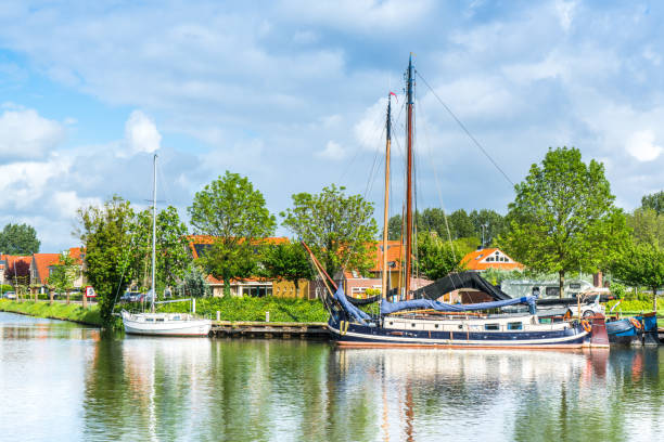 istock Yachts and barges in a canal in Edam, Netherlands 1147986468