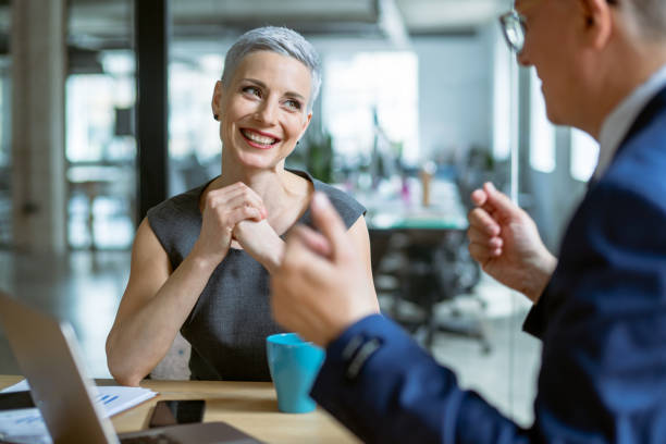 istock Business persons talking in conference room 1147991435