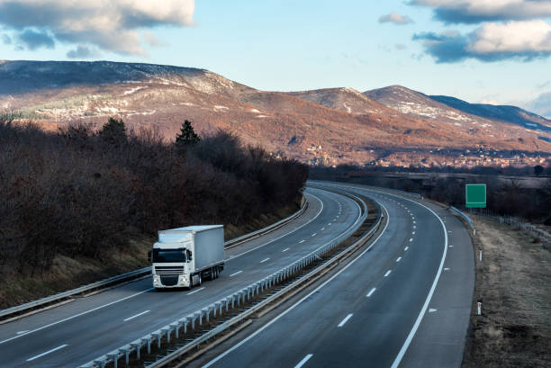 istock Single White lorry truck on country highway 1147992332
