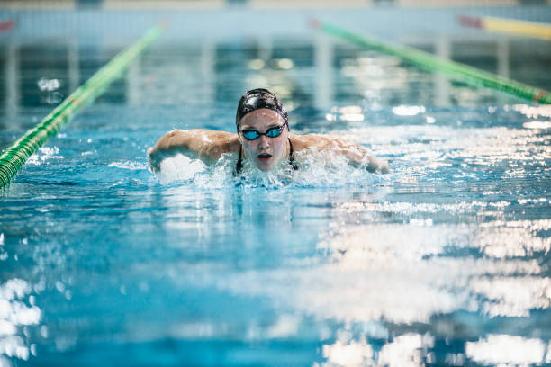istock Female swimmer - butterfly stroke 1147995812