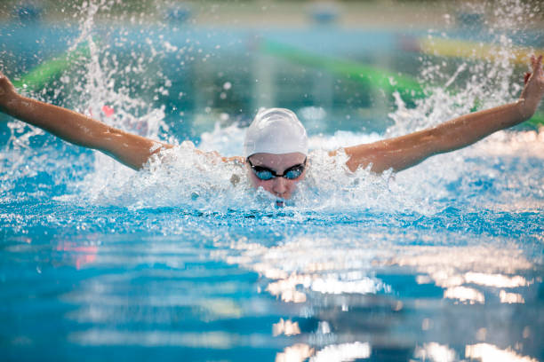 Female swimmer - butterfly stroke stock photo