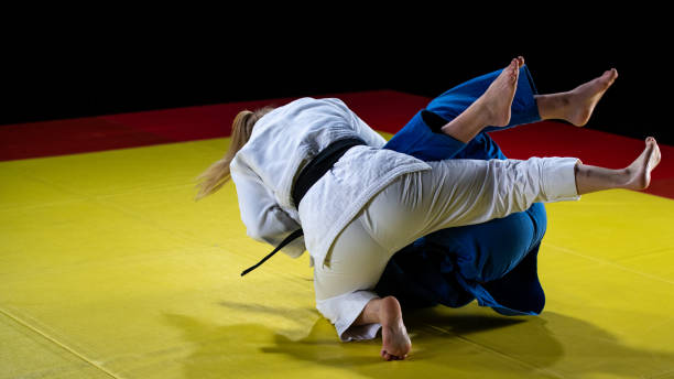 istock Judo players competing in judo match 1147997043
