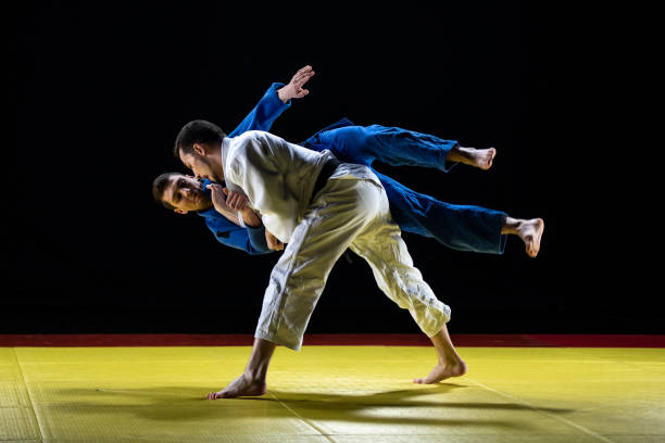 istock Judo players competing in judo match 1147997050