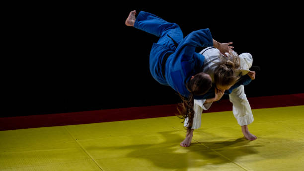 istock Judo players competing in judo match 1147997060