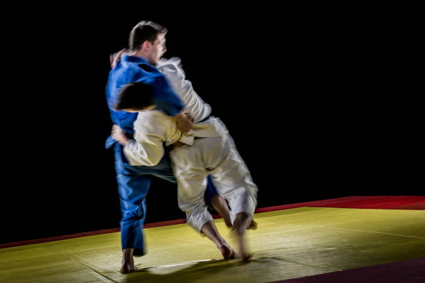 istock Judo players competing in judo match 1147997064