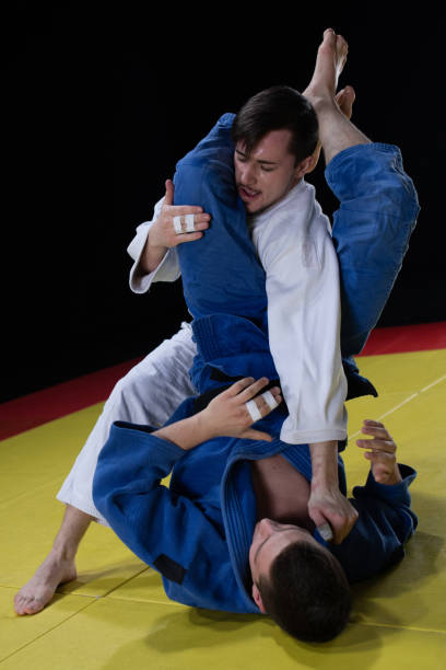 istock Judo players competing in judo match 1147997068