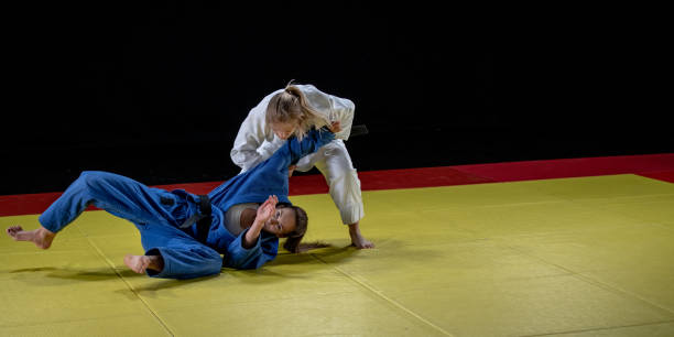 istock Judo players competing in judo match 1147997069