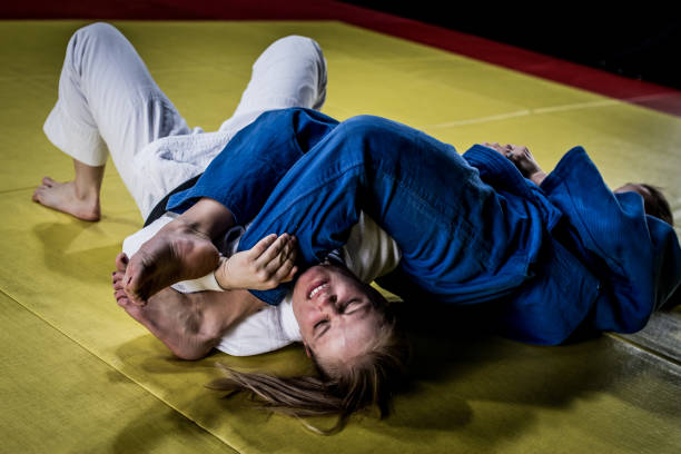 istock Judo players competing in judo match 1147997074