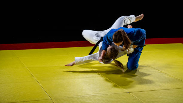 istock Judo players competing in judo match 1147997075