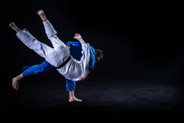 istock Judo players competing in judo match 1147997081