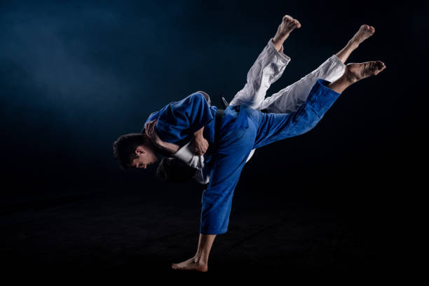 istock Judo players competing in judo match 1147997082