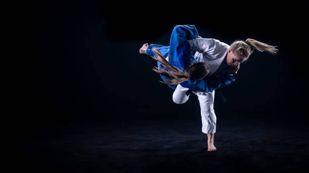 istock Judo players competing in judo match 1147997086