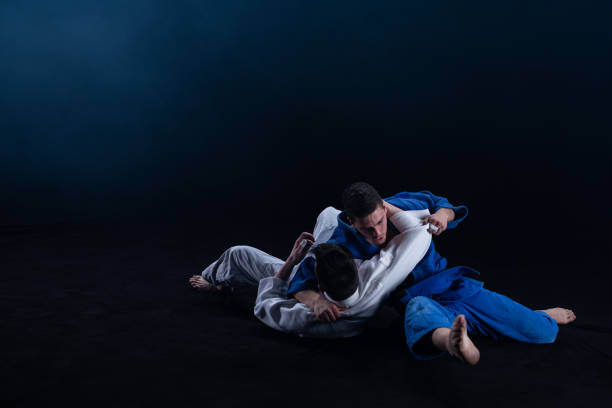 istock Judo players competing in judo match 1147997087