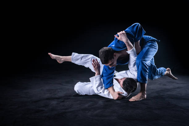 istock Judo players competing in judo match 1147997092