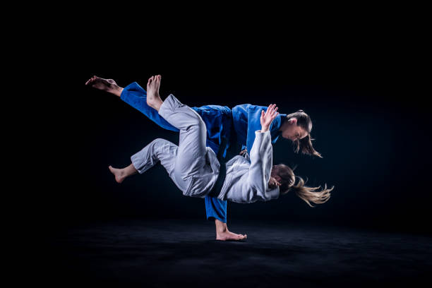 istock Judo players competing in judo match 1147997094