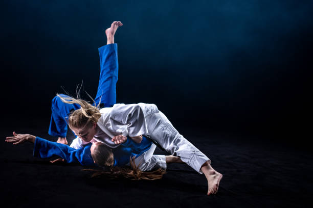 istock Judo players competing in judo match 1147997097