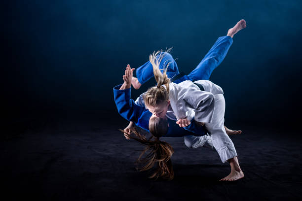 istock Judo players competing in judo match 1147997099