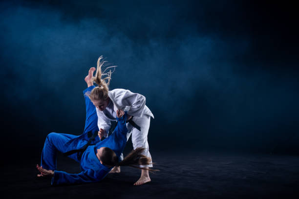 istock Judo players competing in judo match 1147997104