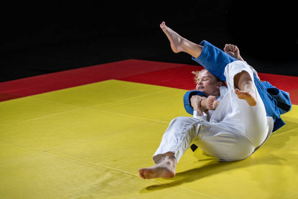 istock Judo players competing in judo match 1147997286