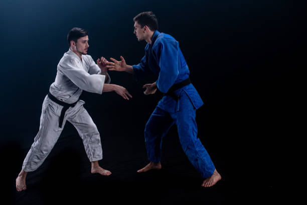 istock Judo players competing in judo match 1147997392