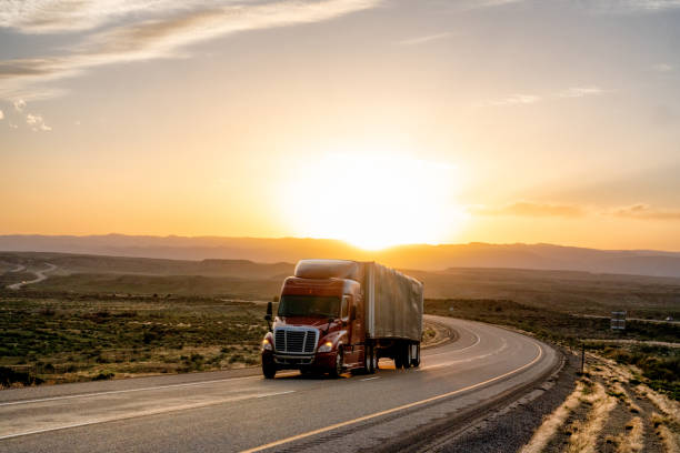 istock Long Haul Semi Truck on a Highway at Dusk under a Dramatic Sky 1148001821