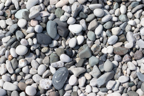 istock Stone round sea multi-colored. Sea pebbles texture, top view closeup. 1148002331