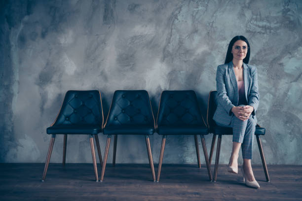 istock Her she nice gorgeous chic stylish top executive manager marketer financier economist brunette lady waiting appointment meeting at industrial loft style interior room work place station concrete wall 1148002347